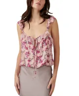 Body de color rosa pálido con estampado floral en tonos fucsia y verde. Presenta escote en V con detalle de encaje y lazo ajustable, breteles finos con volados y corte ajustado.