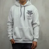 Canguro gris claro con capucha y cordones negros. Estampado en el pecho con texto en azul marino, dibujo de un fantasma y texto de la marca Duxon Jeans.