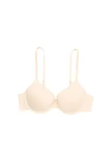 Soutien con copa preformada y aro, confeccionado en microfibra color beige. Cuenta con breteles desmontables y ajustables, y cierre trasero con broche multiposición.