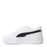 Championes Puma modelo Karmen II Leather, de diseño urbano con plataforma. Presentan un exterior de cuero blanco con la icónica franja lateral de Puma en color negro y logo plateado. Cuentan con suela de goma robusta y plantilla acolchada para mayor confort.