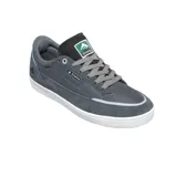 Championes de skate Emerica modelo Gamma, color negro con detalles en verde en la lengüeta. Presentan una construcción resistente con paneles de gamuza y material sintético, suela de goma vulcanizada y logo de la marca en el lateral y lengüeta.