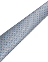 Corbata de seda azul marino con estampado paisley en tonos rosados y blancos.