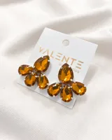 Aros colgantes con forma de flor, con engarce plateado y cristales color ámbar.