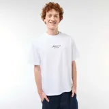 Remera blanca de manga corta y cuello redondo, de corte holgado, con un pequeño bordado en el pecho con la inscripción "Miami palm city".