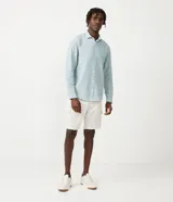 Camisa de manga larga Marfinno con cuello camisero y cierre frontal de botones. Confeccionada en tejido plano de lino y algodón.