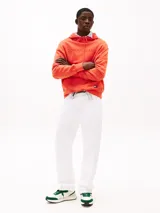 Zapatillas Tommy Jeans de corte bajo, color blanco con detalles en verde. Capellada de ante y malla, con logo de la marca en el lateral. Suela de goma dentada.