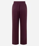 Pantalón de corte recto con cintura elástica y lazo de ajuste frontal. Confeccionado en tejido modal con caída fluida y estructura cómoda.