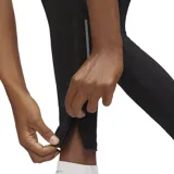 Calza larga de running Nike Dri-FIT Challenger, color negro, con logo blanco en el muslo y detalles reflectantes en la parte inferior de la pierna.