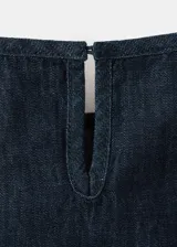 Top de algodón estilo denim con cuello halter y diseño sin mangas.