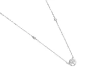 Collar de plata con dije circular calado con diseño de árbol de la vida y circonias.