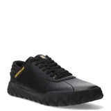 Zapatos Caterpillar modelo Hex + Cuero, color negro, estilo sneaker de caña baja con cordones. Presentan una capellada de cuero liso y textil, con suela de goma gruesa con patrón hexagonal en relieve. El logo Caterpillar en amarillo se encuentra en el lateral.
