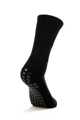 Medias deportivas de caña media Lotto modelo Ciao, color blanco con la marca y el logo en negro en el lateral superior, y apliques de goma antideslizantes negros en la planta del pie.