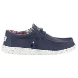 Mocasines Hey Dude Wally Stretch color azul marino, con interior estampado floral y suela blanca con motas negras.