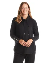 Buzo de tejido suave color gris melange, con cuello volcado ajustable mediante cordones con punteras metálicas. Presenta mangas largas con puños anchos decorados con botones metálicos, hombros caídos y un diseño de silueta holgada con ruedo redondeado y aberturas laterales.