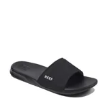 Ojotas Reef One Slide color negro, con plantilla de EVA moldeada por inyección y correa acolchada.