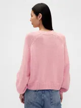 Buzo de punto de algodón con cuello redondo, mangas largas con hombros caídos y puños y ruedo acanalados. Diseño de corte holgado.