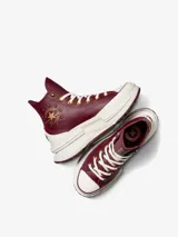 Championes Converse Run Star Legacy CX HI de caña alta, color borgoña con detalles en dorado y blanco. Confeccionados en cuero con plataforma chunky y suela de goma.