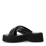 Sandalias negras con plataforma y tiras acolchadas cruzadas.