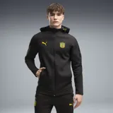 Campera deportiva con capucha y cierre frontal completo de la marca Puma, modelo CAP Hooded Jkt, en color negro con detalles en amarillo. Incluye el escudo del Club Atlético Peñarol y el logo de Puma en el pecho.