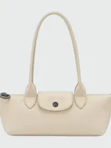 Cartera de hombro Longchamp modelo Le Pliage Xtra en tamaño pequeño, confeccionada en cuero con diseño minimalista, cierre de solapa con botón a presión y doble asa fija.