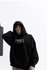 Canguro blanco de corte oversize con capucha y cordones ajustables. Presenta un estampado frontal con el texto 'BRIGHT FUTURE' en contorno azul y el logo de la marca en color naranja. Incluye bolsillos laterales.