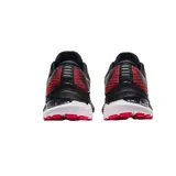 Championes de running Asics Gel-Kayano 28, color negro con detalles en rojo. Diseño técnico con malla transpirable, amortiguación Gel en el talón y entresuela con tecnología FF Blast para mayor estabilidad y retorno de energía.