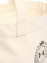 Bolso tipo tote de lona color beige, con diseño de logo Under Armour Athletics estampado en el frente. Cuenta con un amplio compartimento principal y correas dobles para llevar al hombro.