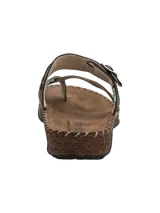 Sandalia de cuero estilo Birkenstock con diseño de tiras cruzadas en el empeine, sujetacintas para el dedo y tira ajustable con hebilla metálica. Suela de corcho y base de goma antideslizante con costuras decorativas visibles.