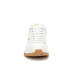 Sneakers Caterpillar modelo Trigen Ws para mujer, de color blanco con detalles dorados y fucsia, y suela dentada de goma marrón.