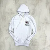 Canguro blanco con capucha, cordones ajustables y bolsillo tipo canguro. Estampado en el pecho con la frase "Better Luck Next Time" y un diseño de un corazón roto con una daga.