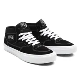 Championes de skate Vans Half Cab, color negro con detalles en blanco. Diseño de media caña con refuerzos DURACAP, plantilla POPCUSH y suela vulcanizada WaffleGrip.