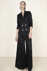 Pantalón palazzo negro con estampado geométrico al tono, confeccionado en cupro.