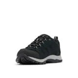 Championes de trekking Columbia modelo Crestwood, color negro con suela gris. Confeccionados con tecnología impermeable Omni-Tech y suela de alta tracción Omni-Grip, diseñados para caminatas y terrenos variados.