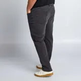 Pantalón jean slim color gris oscuro, con corte ajustado y tiro medio.