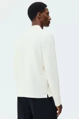 Remera polo de manga larga H&M en punto jacquard de mezcla de algodón, con cuello clásico, tapeta con botones y corte ajustado.