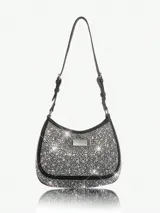 Cartera de mano negra con strass plateados, asa corta y logo metálico plateado.