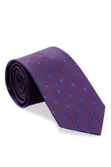 Corbata morada con estampado de flores azules.
