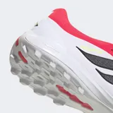 Championes de fútbol Adidas Predator League con lengüeta plegable, diseñados para césped artificial. Presentan una combinación de colores blanco, rosa y negro, con tecnología Nanostrike en el empeine de malla y Powerspine para mayor estabilidad y potencia en el disparo.