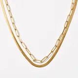 Collar doble dorado con cadena de eslabones alargados y cadena de eslabones planos tipo espiga.