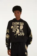 Buzo con capucha negro Farm Rio, confeccionado en algodón y poliéster, con mangas largas y estampado botánico y de animales en color beige en el frente y las mangas.