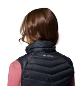 Chaleco acolchado negro de cuello alto, con cierre frontal completo y bolsillos laterales con cremallera.
