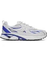 Championes Under Armour modelo Apparition Tech, diseño retro inspirado en el running con base blanca y detalles en azul vibrante. Presenta una parte superior de malla transpirable con superposiciones de cuero sintético, amortiguación reactiva UA HOVR y suela de goma completa.