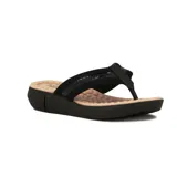 Ojotas negras con plataforma baja y plantilla texturizada color beige.