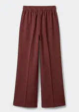 Pantalón de tiro medio con cintura elástica y corte recto de pierna ancha. Presenta pinzas frontales y bolsillos laterales.