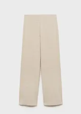 Pantalon de corte wide leg y diseño recto, confeccionado en tejido de punto ligero. Presenta tiro medio y cintura con elástico para mayor comodidad.