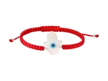 Pulsera de hilo rojo trenzado con dije de nácar en forma de mano de Hamsa con ojo azul.