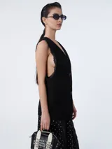 Chaleco oversize negro con solapas, doble botonadura y bolsillos de ojal.
