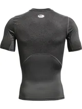 Remera de compresión de manga corta Under Armour, diseñada con tecnología HeatGear para una gestión eficiente del sudor y secado rápido. Presenta un ajuste ceñido al cuerpo, paneles de malla estratégicos para ventilación en axilas y espalda, y mangas raglán híbridas que permiten mayor libertad de movimiento.