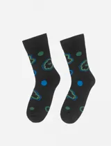 Par de medias negras con estampado de flores y lunares en azul y verde.