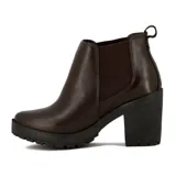 Bota tipo Chelsea de cuero negro con paneles elásticos laterales, taco cuadrado y suela con plataforma dentada.